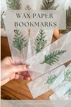 someone is holding up some christmas tree bookmarks with the title overlay that reads, wax paper bookmarks