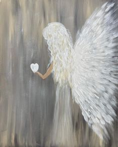 an angel holding a white heart in its right hand