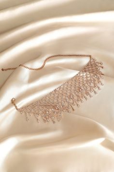 This sumptuous piece of jewelry features a retro-elegant yet slightly modern style that complements the lavish garments, reminiscent of the roaring 1920s. Features: High quality rhinestones Multi layer sparkling rhinestone tassels Height: 2.36 inch / 6 cm Length: 20 inch / 50.8 cm (extension chain included) Rose Gold Crystal Necklaces For Party, Glamorous Diamond Necklaces For Parties, Glamorous Cubic Zirconia Rhinestone Necklace, Elegant Rose Gold Rhinestone Necklace For Party, Glamorous Sparkling Crystal Bridal Necklace, Elegant Sparkling Bridal Necklace For Party, Elegant Rose Gold Bridal Necklace For Party, Elegant Crystal Rhinestone Necklace With Bling, Elegant Rhinestone Crystal Necklace With Bling