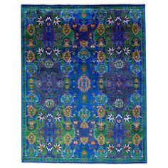 This luxuriously sophisticated woven area rug blends Indian wool and silk. It showcases a blue backdrop adorned with an elegant floral pattern that displays splashes of green and orange for a burst of vibrant color. This rug measures 8' x 10'. Our rugs are professional cleaning before shipping. Indian Rug, Blue Backdrop, Woven Area Rug, Blue Backdrops, Indian Rugs, Fine Rugs, Transitional Rugs, Silk Rug, Abstract Rug