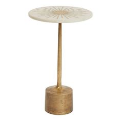 a gold and white table with an umbrella on it's base, against a white background