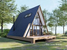 a - frame house in the middle of a grassy area with trees and grass around it