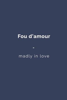 the words'fou d'amour - madly in love'on a dark blue background