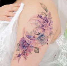 a woman's arm with flowers on it