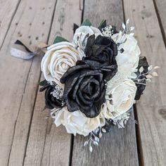 a bridal bouquet with black and white flowers