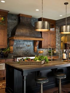 a large kitchen with an island, stove and oven in it's center area