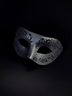 Black vegan leather masquerade mask with an engraved design. Cheap Black Themed Masks, Luxury Artistic Black Mask, Luxury Black Party Masks, Luxury Black Theater Masks, Black Elegant Mask, Veil Mask Men, Bird Mask Black, Black Luxury Eye Mask For Masquerade, Luxury Black Eye Mask For Masquerade