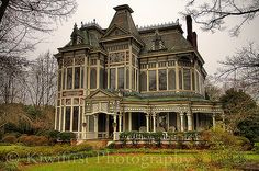 an old victorian style house with many windows