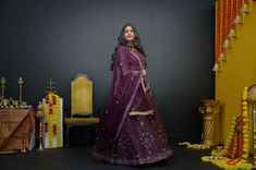 Plum Purple mirror work lehenga choli Matched with Purple mirror work blouse with quarter sleeves. Designed with round neck and has back hooks. Set together with a matching soft net purple duppata with mirror work and have gold border The length of the blouse is 14 inches. Blouse can fit a size 32 to 42 The maximum length of the lehenga will be 41 inches. Slight variation in color is possible due to digital photography. This is a 3 piece set. Care: dry clean only We provide side fitting/sleeves Purple Dola Silk Dupatta With Mirror Work, Designer Purple Dupatta With Mirror Work, Purple Designer Dupatta With Mirror Work, Purple Designer Wear Dupatta With Mirror Work, Purple Dupatta With Mirror Work For Designer Wear, Designer Purple Lehenga With Sheer Dupatta, Purple Saree With Mirror Work, Designer Purple Choli With Gota Work, Festive Purple Sets With Mirror Work