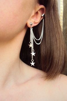 A silver or gold celestial star ear cuff set will be a great gift for a person who loves unusual handmade jewelry. The star charms are very light, you can barely feel the weight. This cuff set is consist of one ear cuff earring and one stud earring. It's lightweight, stylish and one size fits all. Gorgeous, stunning and original jewelry for your outlook! The length of earring is 3.5 in. The upper part of the cuff is fake, no need a piercing. Material of this ear cuss set is nickel free jewelry a Ear Cuff Diy, Popular Jewelry Trends, Silver Earring Cuff, Earrings With Chain, Ear Wrap Earrings, Northern Star, Ear Cuff Jewelry, Fake Earrings, Ear Chain