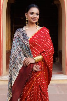 Red pure bandhani gajji silk saree with floral ajrakh hand block printed pallu and a yellow bandhani border around all edges. Comes with unstitched beige blouse piece with ajrakh hand block print. - Aza Fashions Red Pre-draped Saree With Traditional Patterns For Navratri, Bohemian Red Pre-draped Saree For Festive Occasions, Bohemian Pre-draped Saree For Festivals And Ceremonies, Red Kalamkari Print Choli With Traditional Drape, Red Bandhani Print Traditional Drape, Navratri Block Print Traditional Blouse Piece, Red Bandhani Print Traditional Wear, Navratri Pre-draped Saree With Traditional Patterns, Red Bandhani Traditional Wear