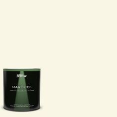 a can of behr marquee paint on a green background