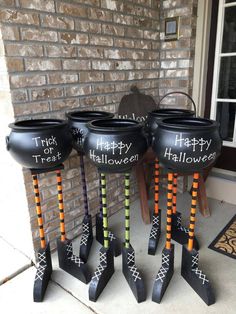 three halloween decorations on the front porch