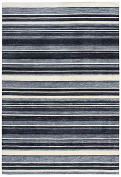 a rug with black and white stripes on the bottom, in different shades of grey