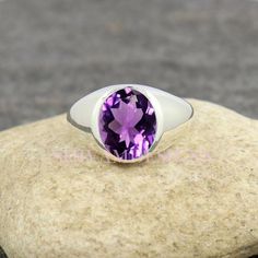 Main Stone: Natural African AmethystMetal Purity: Solid 925 Sterling SilverMetal Color: Bright Silver & More OptionGemstone Weight: 4.0 caretsSilver Weight: 7.70 gramsGross Weight: 8.50 gramsGemstone Size: 10x12mmStone Shape: Oval-----------------gift for father, gift for dad, fathers day ring, ring for dad, Classic Purple Signet Ring For Anniversary, Classic Purple Round Band Ring, Classic Amethyst Signet Ring For Anniversary, Classic Amethyst Round Band Ring, Amethyst Signet Ring With Gemstone For Anniversary, Amethyst Signet Ring With Polished Finish For Anniversary, Purple Gemstone Signet Ring For Anniversary, Amethyst Gemstone Signet Ring For Anniversary, Anniversary Purple Signet Ring With Polished Finish