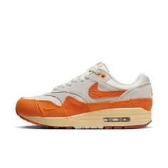 Meet the leader of the pack. First released in '87, the Nike Air Max 1 was the first shoe in the family to bring Air technology to sneaker enthusiasts. Vibrant pops of orange infuse this legend with new energy, giving it a fast-paced look perfect for today’s modern world. With tried-and-true Air cushioning underfoot and a classic wavy mudguard, it’s no wonder these kicks continue to reign supreme. Suede on the upper adds durability and a premium look.Foam midsole and visible Max Air in the heel Nike Models, Air Max Shoes, Nike Shoes Air Max, Nike Air Max For Women, Nike Air Max 1, Air Max Women, Clean Shoes, New Energy, Air Max 1