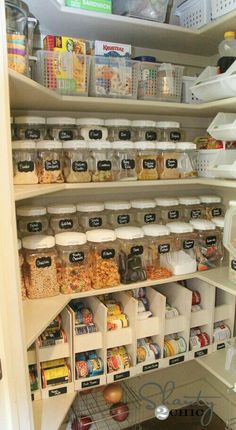 the pantry is stocked with lots of food and containers, including cereals or other items