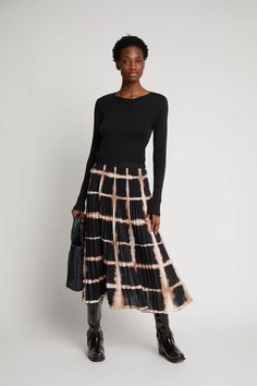 This midi skirt emits a leisurely, yet, elegant style with its intricate pleat detailing and elastic waistband. Suitable for work or play, the skirt’s beautiful all-over print can be balanced out with a relaxed knit or turtleneck for an elevated look or a slim-fit tee for more casual styling. Details: The model is 5’ 8” and wears a size 36 Fit: Regular / Midi long Munthe aims to produce printed styles with a minimum of waste in mind. This means that every style has small differences in how the p Chic Pleated Waist Maxi Skirt For Fall, Chic Fall Maxi Skirt With Pleated Waist, Fall Pleated Skirt With Elastic Waistband, Relaxed Fit, Workwear Midi Length Pleated Skirt With Elastic Waistband, Pleated Midi Skirt With Elastic Waistband For Work, Elegant Fall Pleated Skirt With Elastic Waistband, Relaxed Viscose Skirt For Fall, Chic Midi-length Pleated Skirt With Elastic Waistband, Chic Midi Length Pleated Skirt With Elastic Waistband