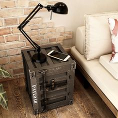 a table lamp sitting on top of a wooden crate