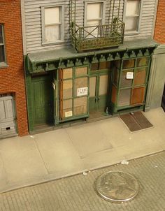 an old fashioned store front on the side of a street