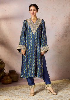 Blue Pixie Dust Tunic And Pants by House Of Masaba, available on Indiaspopup.com Luxury Tunic With Embroidered Neckline For Eid, Luxury Festive Tunic With Dabka Detailing, Luxury Embroidered Neckline Tunic For Eid, Luxury Designer Tunic With Dabka Work, Luxury Dabka Embellished Women's Tunic, Luxury Blue Elegant Tunic, Luxury Blue Tunic Set, Luxury Traditional Tunic With Zari Work, Luxury Festive Tunic With Dabka Work