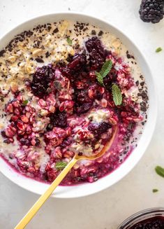 a bowl filled with oatmeal and berries