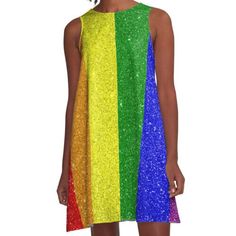 a woman wearing a rainbow dress with sequins