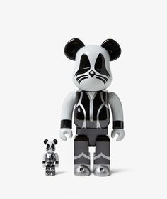 a bear and panda bear are standing next to each other in front of a white background