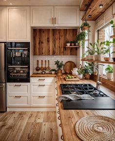 a kitchen with wooden floors and white cabinets