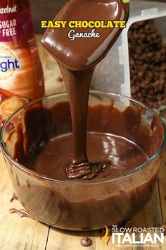 chocolate ganache being poured into a glass bowl