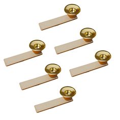 four brass door knobs with white plates on the front and back of each one