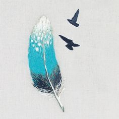 three birds flying in the sky next to a blue and white feather