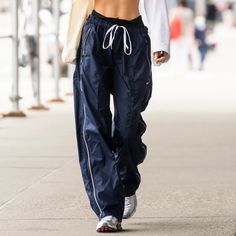 Vintage Nike Blue Sweatpants With Zipper Detailing. As Seen On Bella Hadid Nike Vintage Pants, Bella Hadid Nike, White Track Pants, Oversized Y2k, Les Benjamins, Blue Sweatpants, Nike Vintage, Vintage Pants, Nike Blue