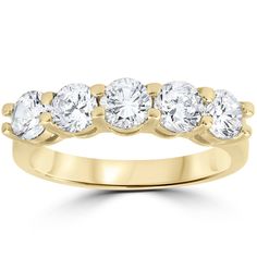 a yellow gold ring with five round diamonds