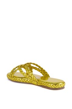 The AZALEA WANG Ammon Yellow Metallic Braided Sandal is a shimmering metallic slide that features a faux leather upper, an open almond toe silhouette, a tonal cushioned footbed, a textured rubber outsole, and braided trim detailing around the midsole. Complete with braided cross front toe and foot bands, a flat sole, and a slip-on fit.   (all measurements are approximate from size 7.5) - Metallic Faux Leather Upper - Open Almond Toe - Flat Sole - Imported  Product ID: 398857 Azalea Wang, Almond, Leather Upper, Braids, Faux Leather, Slip On, Size 7, Trim, Sandals