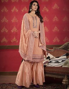 luxury Women Peach colored Salwar Kameez in Sharara Style made with Faux Georgette top and Faux Georgette Bottom fabricProcessing Time : 5-7 Business DaysWork : Heavy Embroidery & Lace WorkFabric:Top : Semi-Stitched SuitsBottom : Faux GeorgetteDupatta : Faux Georgette Sangeet Sharara, Peach Sharara, Sharara Style, Sharara Suits, Georgette Tops, Heavy Embroidery, Statement Dress, Embroidery Lace, Work Fashion