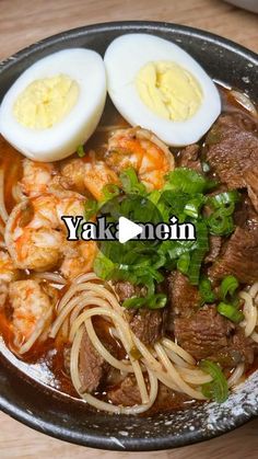 a bowl filled with noodles, meat and hard boiled egg on top of each other