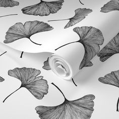 black and white wallpaper with ginko tree leaves on the back ground, as well as an abstract design