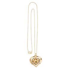 "This charming 14k yellow gold and Ruby pendant features two articulating hearts, both fashioned into a dome with a solid flat back. The inside heart is bead set with eight round Rubies; the inside heart dangles inside the center of the larger open heart, which has six bead-set, round Rubies. Perfect sentimental gift for your heart throb!   -  14k yellow gold  -  Outer Heart (frame): 1.13\" x 1.03\" x .17\" (28.80 wide x 26.30 long x 4.50mm deep) -  Inside Heart: .70\" x .63\" x .23\" (18.00 wid Valentine's Day Double Heart Jewelry With 17 Jewels, Yellow Gold Double Heart Locket Jewelry, 14k Gold Heart Pendant With Heart Beads Jewelry, 14k Gold Polished Heart Pendant Necklace, Yellow Gold Heart Beaded Pendant Necklace, Gold-tone Heart Pendant Jewelry For Anniversary, Yellow Gold Double Heart Necklace With 17 Jewels, 14k Gold Pendant Heart Necklace With Polished Finish, Yellow Gold Double Heart Necklace With Heart Beads