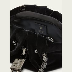 Givenchy "Kenny" top handle bag in satin silk Logo chain top handles  Detachable crossbody strap Can be worn as a top handle or crossbody bag  Ruched top with magnetic closure; padlock accent  Lining: Silk Approx. 4.3"H x 11.4"W x 4.3"D Made in Italy High-end Evening Pouch Bag, Designer Top Handle Shoulder Bag For Events, Luxury Top Handle Evening Bag, Luxury Evening Bag With Chain Strap And Top Handle, Luxury Evening Bag With Handles For Events, High-end Top Handle Evening Bag, Luxury Silver-tone Pouch Evening Bag, Luxury Evening Bag With Palladium Hardware, High-end Evening Bag With Chain Strap