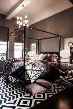 an instagramted photo of a bedroom with black and white decor on the bed