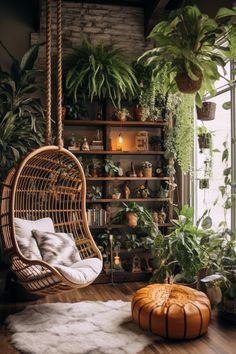 a room filled with plants and hanging chairs in front of a window, next to a rug on the floor