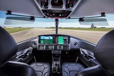 the cockpit of an airplane with two pilots in it