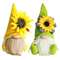 two gnomes with hats and sunflowers on their heads sitting next to each other