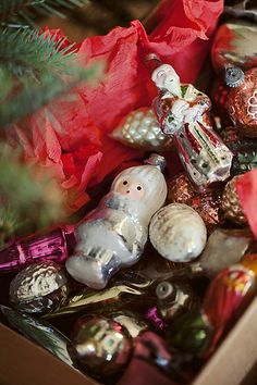 an assortment of christmas ornaments in a box