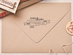 a close up of an envelope with a rubber stamp on it and some other items