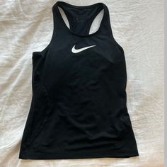 Never Worn Can Fit Womens Xsmall Black Fitted Running Tops, Basic Black Go-dry Tops, Nike Black Training Tops, Black Racerback Top With Medium Support, Nike Black Sporty Tank Top, Functional Black Racerback Top, Basic Black Racerback Top, Black Fitted Tank Top For Running, Fitted Black Tank Top For Running