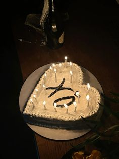 a birthday cake with candles in the shape of an eye and letter s on it