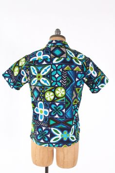 "vintage 1960s mod mens green blue HAWAII shirt mid century modern hawaiian tiki hippie summer spring sz M Near mint condition, no serious flaws to note. Tagged M Chest: 40\" Shoulder: 18\" Length: 28\" All sales are final, please ask questions before purchasing. Size medium" Green Hawaiian Shirt With Graphic Print, Retro Green Hawaiian Shirt With Graphic Print, Retro Green Hawaiian Shirt For Vacation, Retro Green Printed Hawaiian Shirt, Fitted Retro Hawaiian Shirt For Vacation, Retro Fitted Hawaiian Shirt For The Beach, Retro Fitted Hawaiian Shirt For Beach, Retro Green Camp Shirt For The Beach, Fitted Retro Hawaiian Shirt For Beach