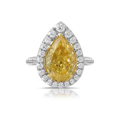 5 carat yellow diamond ring. Fancy intense yellow diamond ring. Yellow diamond radiant ring. Yellow diamond engagement ring. Canary yellow diamond ring. Yellow Diamond Ring, Yellow Diamond Engagement Ring, Yellow Diamond Rings, Pear Shaped Diamond, Yellow Diamond, Diamond Halo, Pear Shape, Halo Diamond, White Diamond